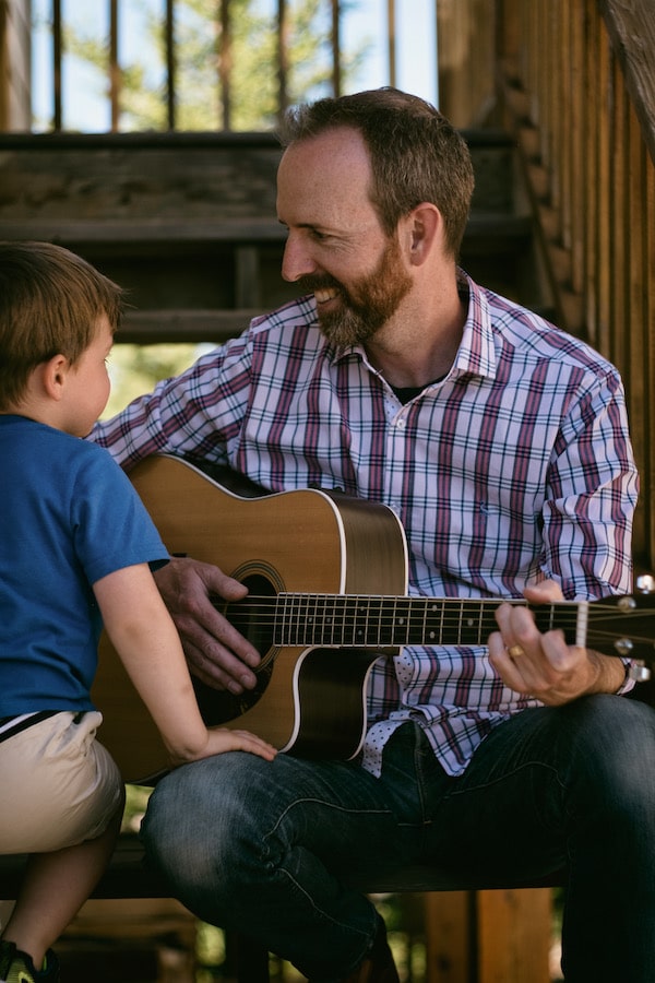 Jason on a staircase with his son